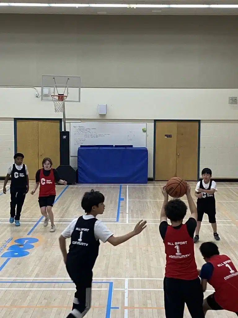 kids throw a ball at stay in the game